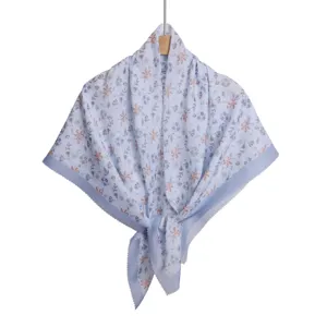 Close-up view of the pastoral style floral print square scarf with delicate wave cut edge.