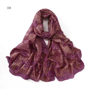 Detailed view of purple pleated cotton linen scarf with shiny gold foil leaf stripe pattern.
