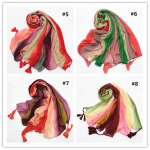 Detailed view of soft gradient cotton linen scarf featuring colorful tassel fringe details.