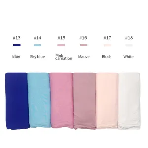 Modal cotton jersey hijab scarf fabric detail showing color variants from blue to white.