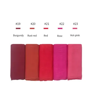 Cotton jersey fabric roll detail, soft breathable modal scarf material in vibrant colors.