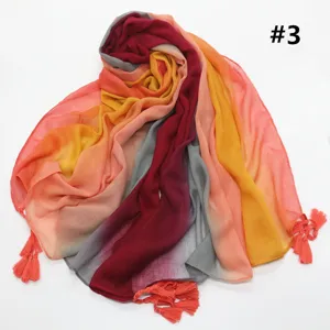 Colorful gradient cotton linen scarf with tassel fringe, vibrant rainbow design detail.