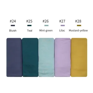 Close-up detail of soft modal cotton jersey headwraps in multiple solid colors style.