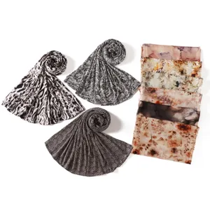 Detailed view of stylish stretch cotton printed long scarves with leopard and snake patterns.