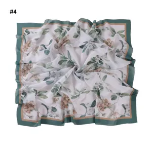 Elegant floral print large square scarf with wave cut edge, perfect versatile fashion accessory.