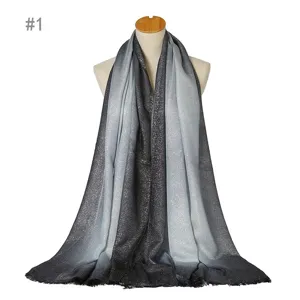 Gradient sparkly silver thread scarf detail showing black and grey ombre tone with fringe.