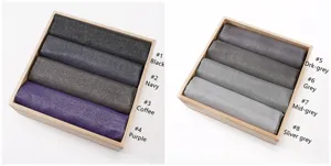 Viscose scarf detail showing rolled solid color metallic fringed shawls in multiple colors.