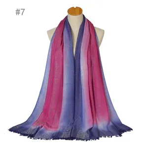 Gradient scarf detail showing sparkling silver threads and delicate short fringe ends.