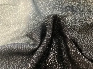 Close-up of metallic silver gradient scarf fabric, showing fine shimmering texture and soft drape.