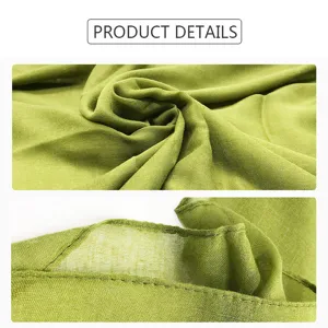 Close-up details of lightweight green cotton linen scarf, showing fine texture and clean edges.