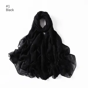 Detail view of a shimmering black glitter hijab scarf, lightweight fabric close-up showcase.