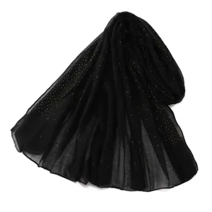Black voile scarf detail, delicate gold rhinestones, lightweight breathable fabric accessory.