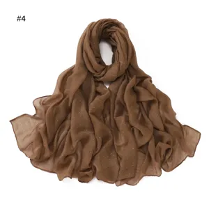 Detailed view of the brown glitter rhinestone bali yarn long scarf with soft texture.
