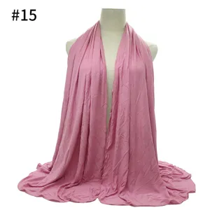 Pink cotton jersey modal hijab detail, soft texture fabric showcase and drape view close up.
