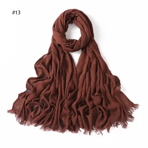 Solid color wrinkled rayon scarf for women, breathable and soft with tassel ends.