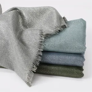 Detailed view of women's metallic glitter viscose scarf with short fringe edges in multi colors.