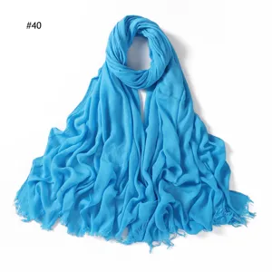 Blue crinkled solid color rayon scarf with fringe ends, lightweight soft breathable head wrap.