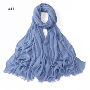 Blue crinkled rayon solid color scarf with fringe ends, soft breathable women's hijab shawl.