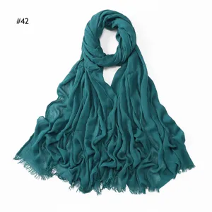 Solid color crinkled rayon scarf with tassels, soft breathable women's hijab, dark green variant