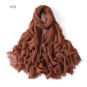 Detailed view of the soft lightweight modal solid color scarf with fringe edges.
