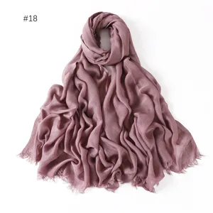 Close-up detail of soft modal cotton scarf with short tassels in elegant mauve color.