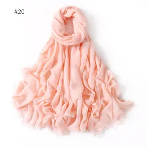 Close-up detail of soft light pink modal cotton scarf, lightweight solid color shawl.