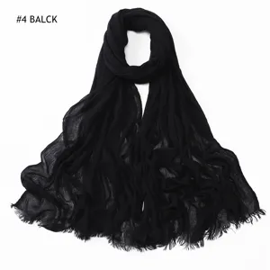 Black pleated rayon scarf for women, soft breathable solid color hijab with tassel ends.