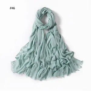 Solid crinkle rayon scarf with frayed ends, breathable mint green hijab for women daily wear.