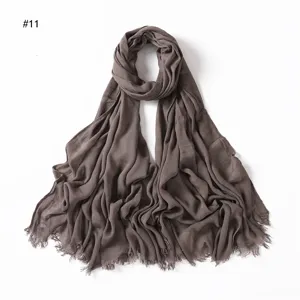 Solid color brown wrinkled rayon scarf with tassel ends, soft lightweight breathable women's hijab.