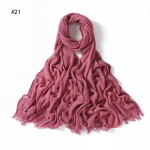 Solid color pleated rayon scarf with frayed fringe edges, soft breathable hijab for women.