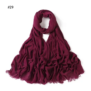Women solid color wrinkled rayon scarf with fringe ends, soft and breathable headscarf.