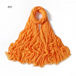 Solid orange rayon wrinkled scarf with frayed ends, soft and breathable women head accessory.