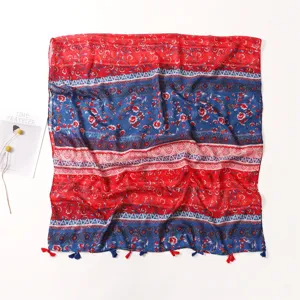 Bohemian floral print scarf detail, red blue color block design with tassel hem.