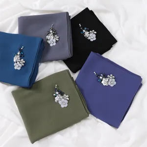 Solid color chiffon scarf featuring exquisite rhinestone flower embellishments, elegant and chic detail.
