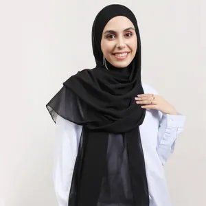 Black chiffon hijab scarf and inner cap set, elegant solid color headscarf detail view for women.