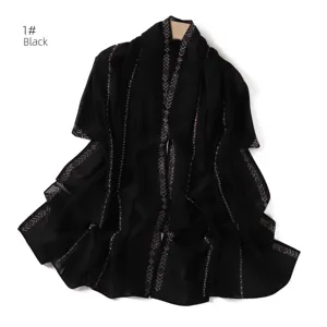 Detail view of black chiffon rhinestone scarf featuring sparkling silver chains for elegant wear.