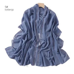 Blue chiffon shawl scarf with rhinestone chain details, elegant long hijab wrap for women.