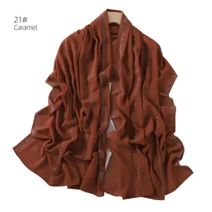 Detail view of caramel chiffon hijab scarf with silver hot drill rhinestone stripes elegant.