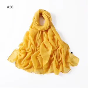 Solid yellow glitter viscose cotton scarf shawl lightweight wrap for women daily wear.
