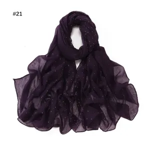 Detailed view of the dark purple voile long scarf featuring sparkling gold foil dots.