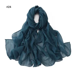 Dark teal voile scarf with sparkling gold dots, lightweight breathable fabric for women detail view.