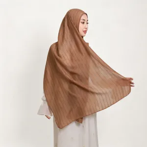 Detailed view of the breathable cotton linen striped sequin long scarf in elegant solid brown.