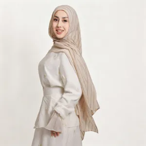 Detailed view of lightweight striped linen hijab scarf with delicate sequins, breathable fabric.