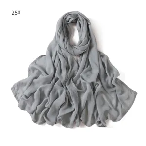 Detail of soft grey modal cotton scarf, lightweight breathable fabric with neat double-needle edge.