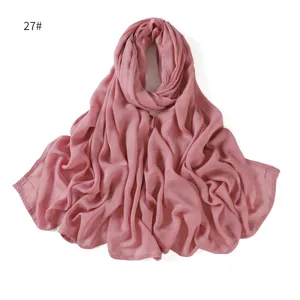 Detailed view of a solid color modal scarf, lightweight and breathable fabric texture.