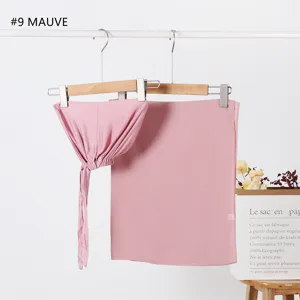 Detailed view of the mauve modal tie cap and plain chiffon scarf set hanging neatly.