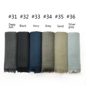 Detailed view of solid color cotton linen fringed shawl scarf in multiple stylish colors.