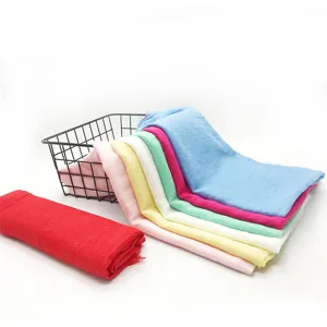 Detailed view of colorful cotton linen scarves with fringe edges, soft and breathable fabric.