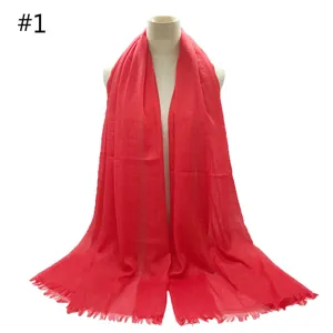 Red cotton blend solid color shawl scarf with fringed edges, breathable long design.