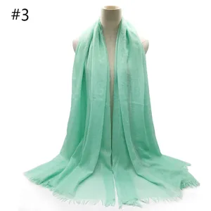 Mint green TR cotton scarf detail, breathable fabric and short fringe close-up shot.